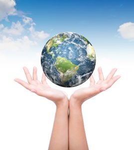 Hands with earth (Elements of this image furnished by NASA)
